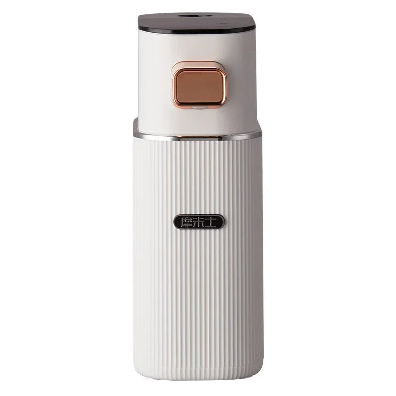 Front view of white compact instant hot water dispenser with rose gold button.