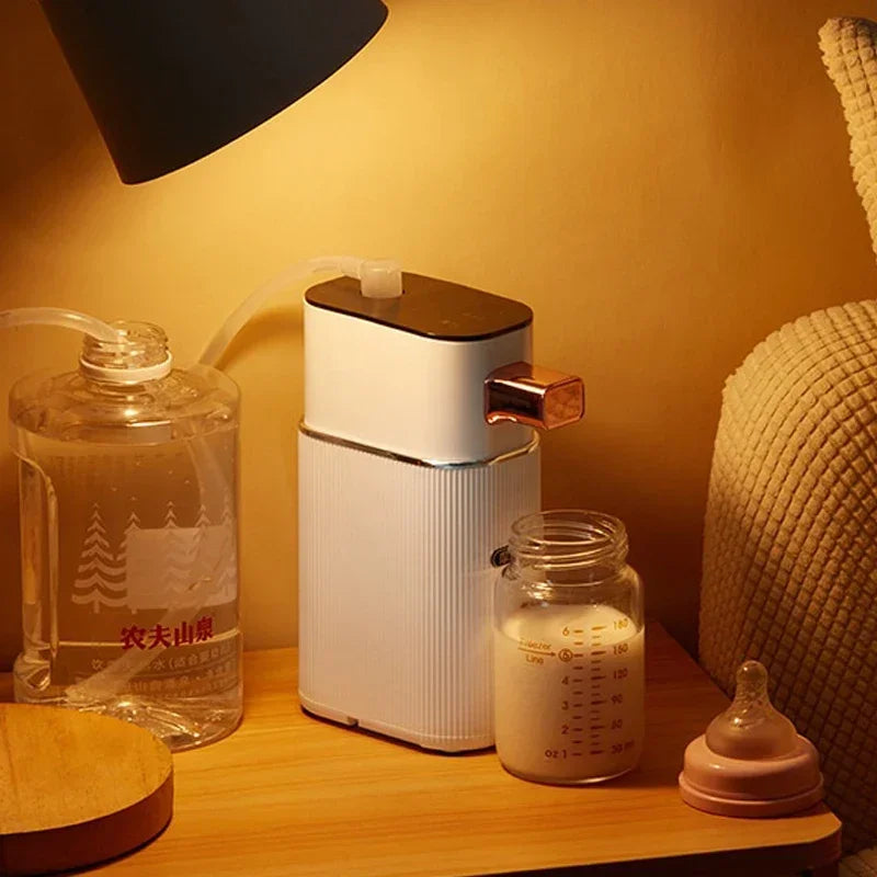 Hot water dispenser heating baby formula at night, next to a baby bottle and water container.