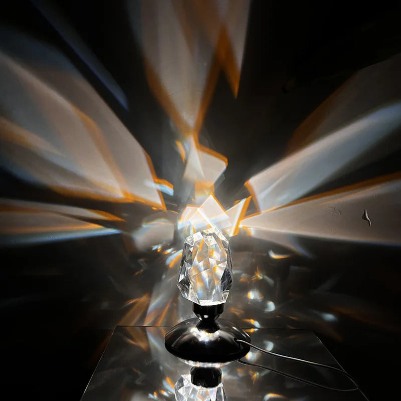 Crystal night lamp casting bright geometric shadows in a dark room

